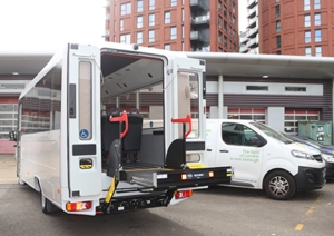 Accessible minibus parked in front of a building