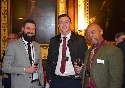 Three men attending an evening reception at the House of Lords