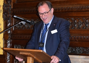 Man giving speech at an evening reception