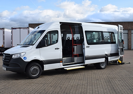 White accessible Mercedes-Benz Sprinter accessible vehicle parked with door open