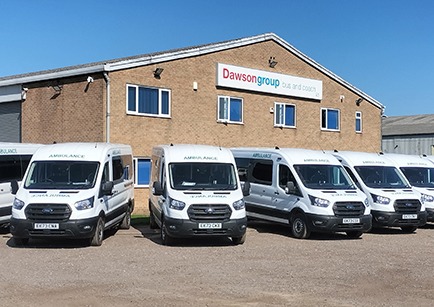 Patient Transfer Service vehicles parked up in front of Dawsongroup bus and coach