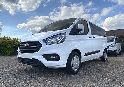 White Ford Transit Kombi minibus