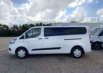 White Ford Transit Kombi minibus