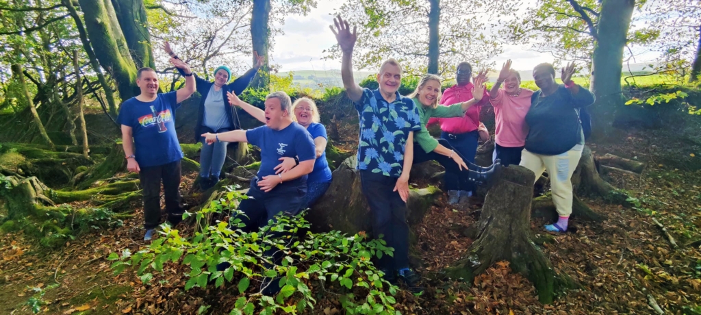 A group of people standing in the woods.