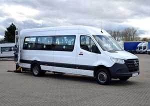 White accessible minibus with rear doors open